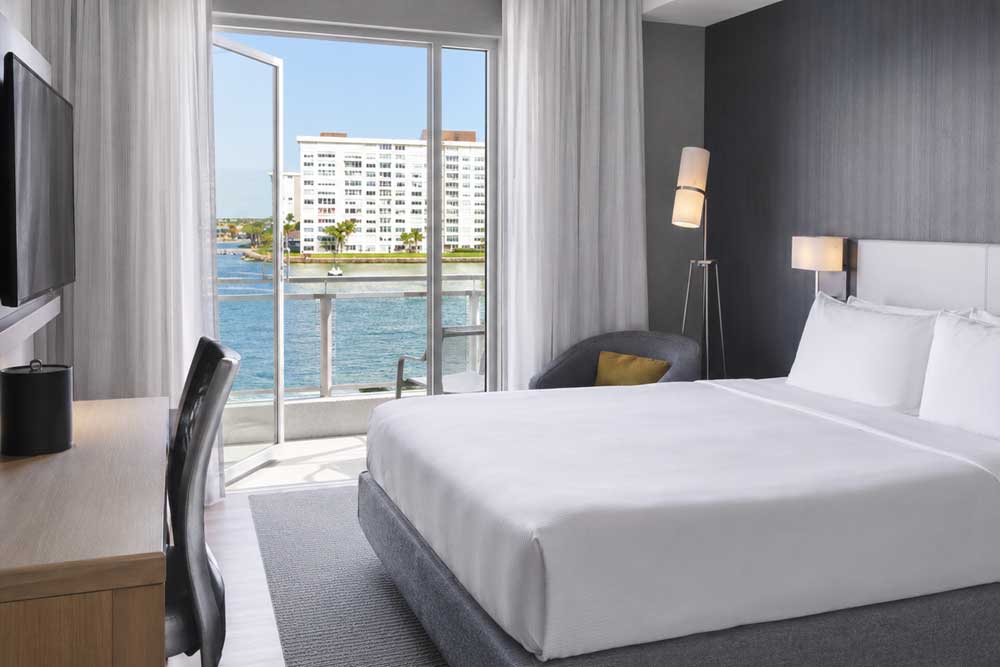 Private waterfront guest room at the Courtyard by Marriott Madeira Beach used for women-only wellness retreat accommodations