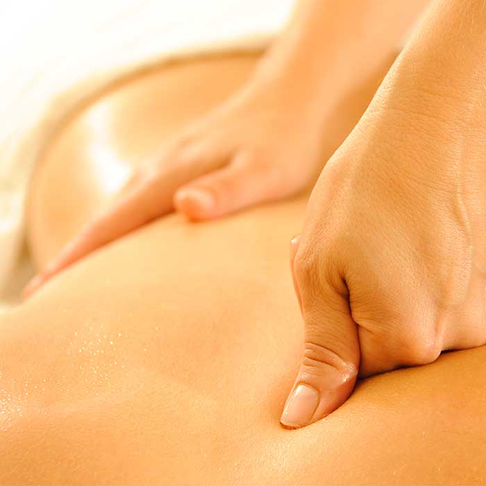 Our expert massage therapist helping a grateful weight loss camp client loosen up.