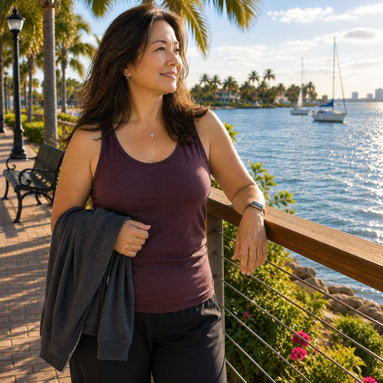 Woman enjoying a peaceful morning walk along the waterfront during a women-only fat camp retreat in Madeira Beach Florida