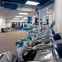 An overweight and senior weight loss camp client do water aerobics together in our private pool at Weight Crafters.