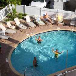 Happy fitness campers enjoying a fun afternoon workout session in the pool at Weight Crafters.