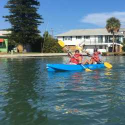 Weight loss retreat clients enjoying a brisk kayaking trip at Weight Crafters