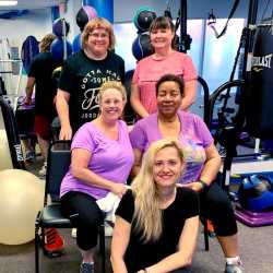 A female client works out under the supervision of an experienced weight loss camp trainer at Weight Crafters.